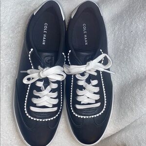 Cole Haan Black and White Lace-Up Sneakers with Scalloped Trim